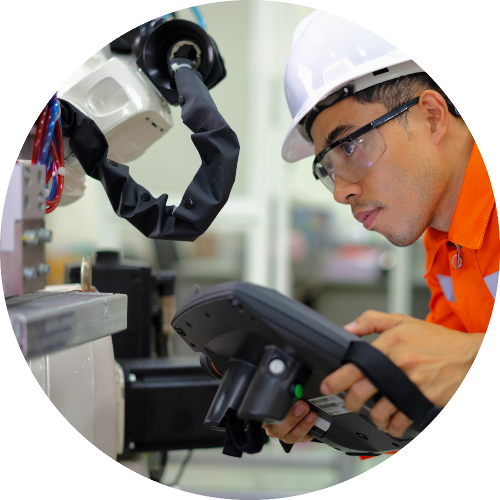 students looking at machine