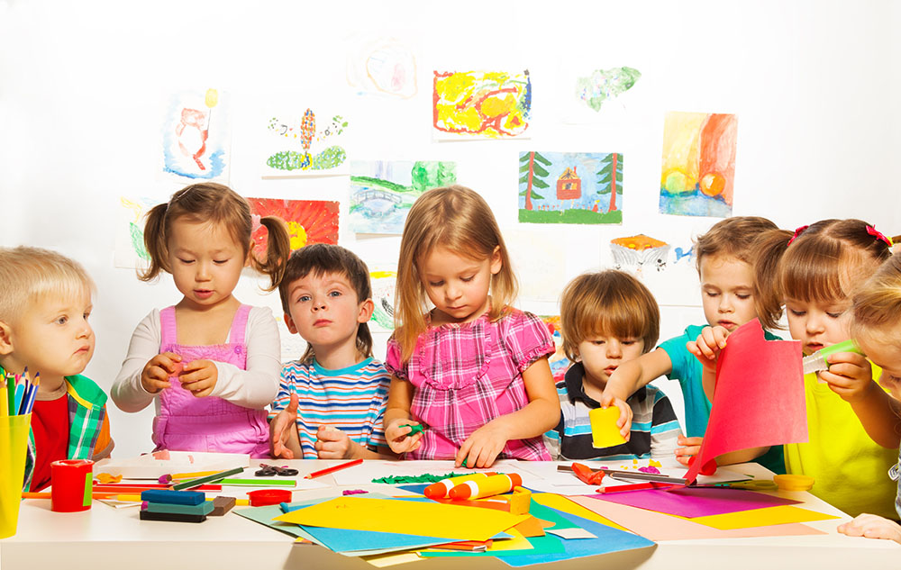 image of young children making art projects
