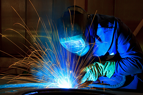 welder welding metal